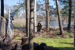 Firefighter Ciccone seen utilizing a booster line to contain the fire